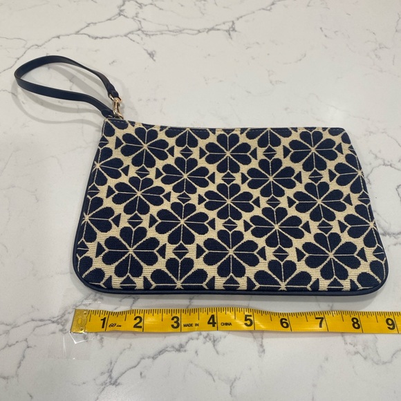 kate spade Handbags - kate spade navy and cream floral wristlet clutch